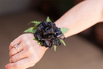 Black spray rose wrist corsage from $55.00