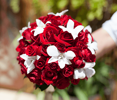 Red Rose and white orchid bouquet starting from $195.00